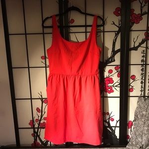 Red/Orange baby doll dress. Has pockets both sides